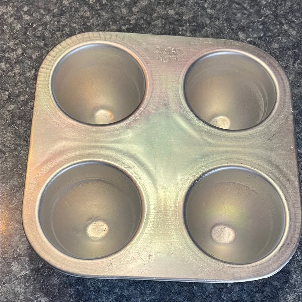Wilton Metallic Muffin Pan - dress, egg